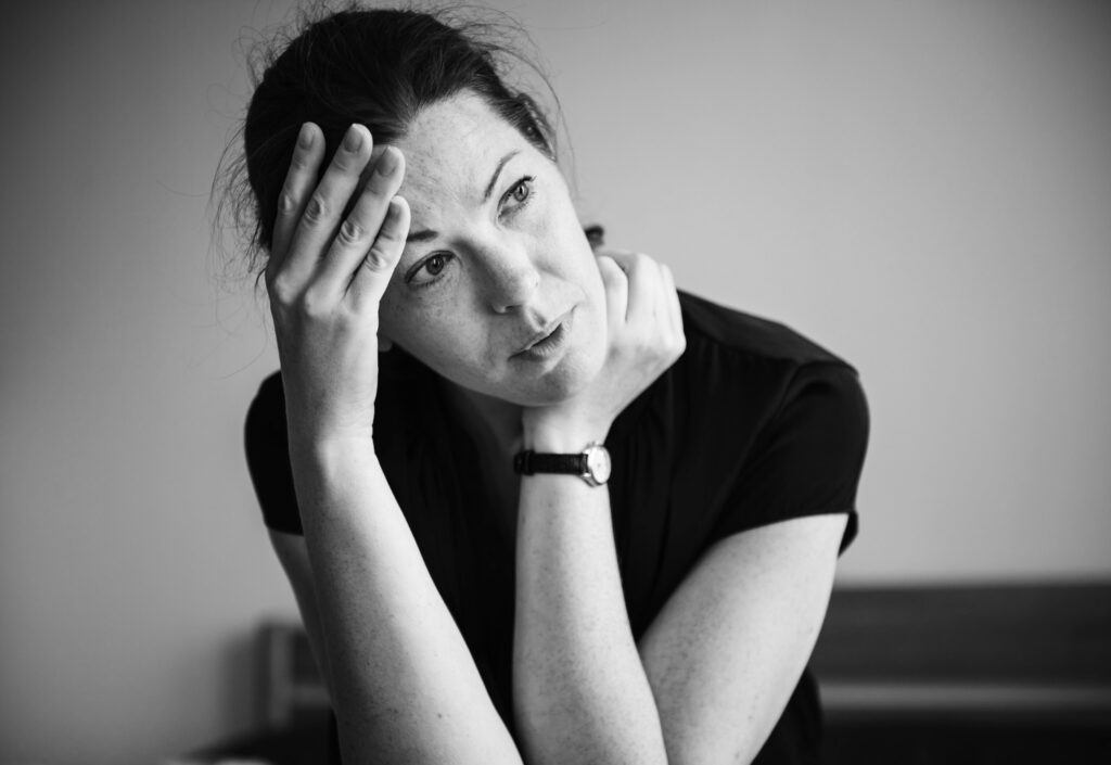 woman feeling depressed in nyc black white photo